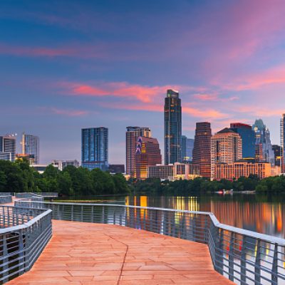 Austin, Texas, USA downtown skyline over the Colorado River at dawn.
